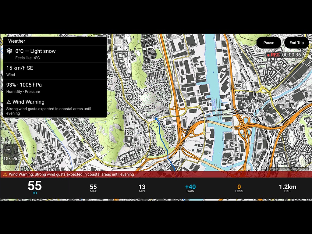 AltitudeTracker running on an Android Automotive car head unit showing a topographic map, weather data with wind warning, and real-time altitude at 55 meters